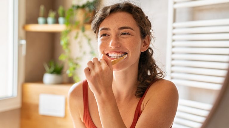 Woman brushing teeth