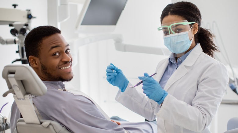 Smiling man visiting dentist