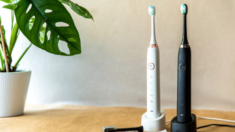 two electric toothbrushes