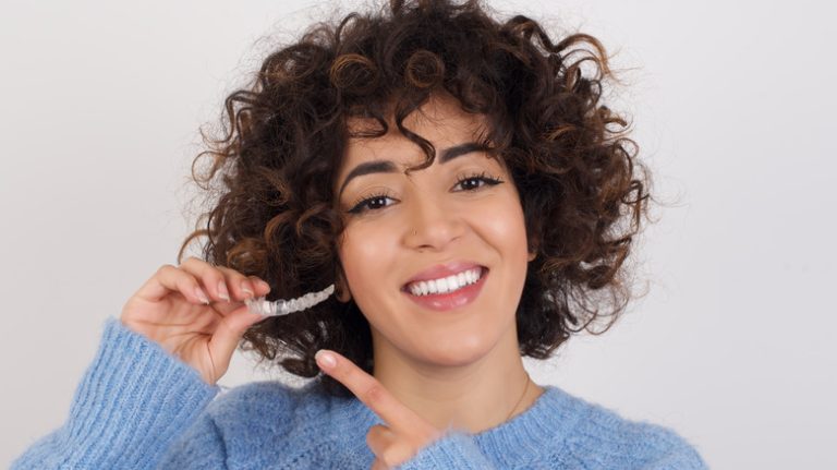 Girl pointing to retainer