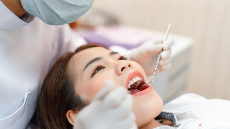 Woman receiving dental cleaning