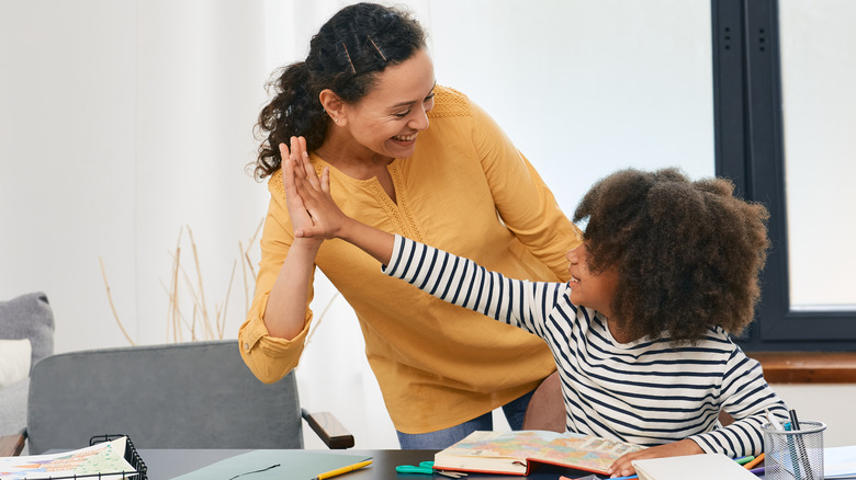 Child sitting near counselor