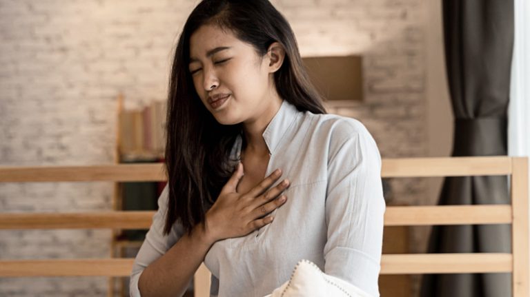 A woman experiences chest pain