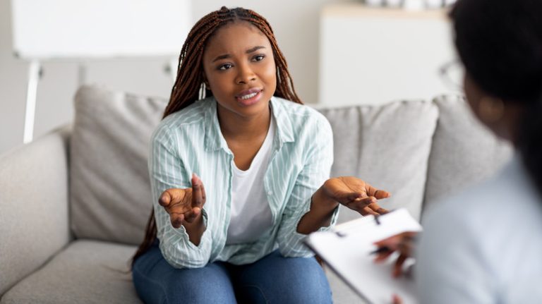 Woman on couch with counselor