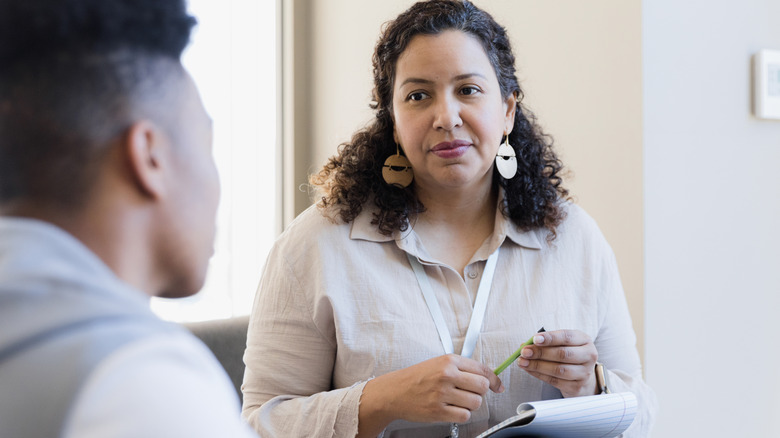 Therapist speaking with patient