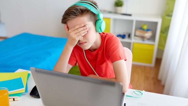 Frustrated boy playing video game