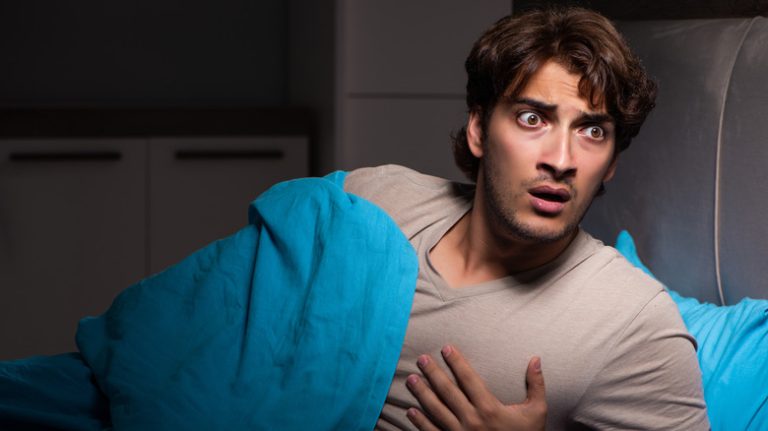 Man having nocturnal panic attack