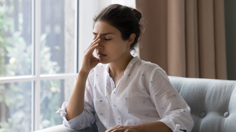 woman sitting on couch