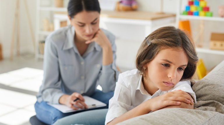 unhappy child at therapist's office