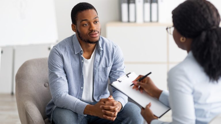 man talking with therapist