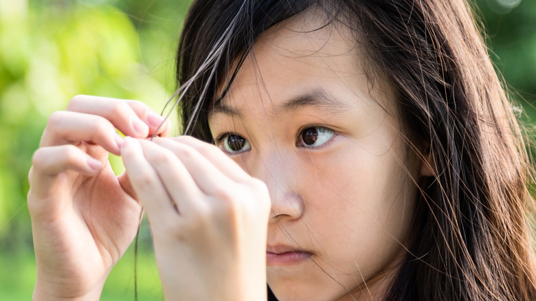 Girl pulling hair out