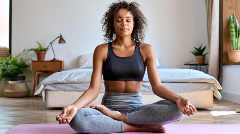 woman sitting relaxed doing breathwork