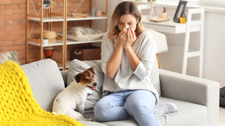 Woman blowing her nose