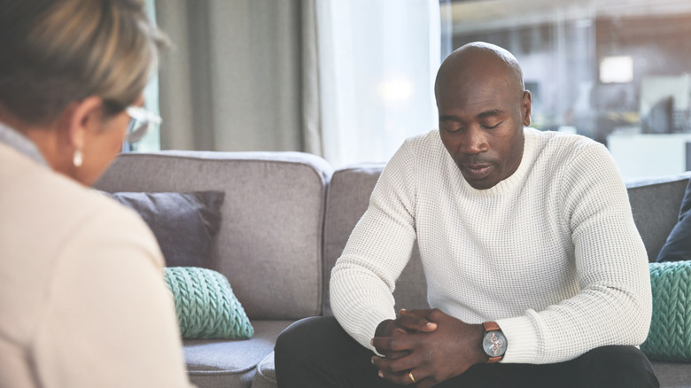 man talking to a therapist